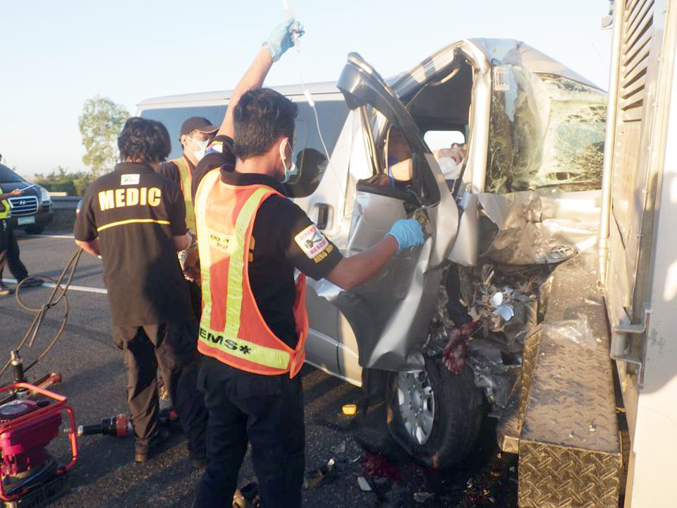 PDRRMC Tarlac in Action: It gives every motorist a comforting thought that the Rescue Team of PDRRMC Tarlac is always there to lend a hand. This photo was taken at SCTEX on December 23 when a Toyota Hi-Ace Versa Van collided with a 10-wheeler truck. A front passenger of the van was pinned down. No casualties, thank God. The rescue team was dispatched after a 911 call.